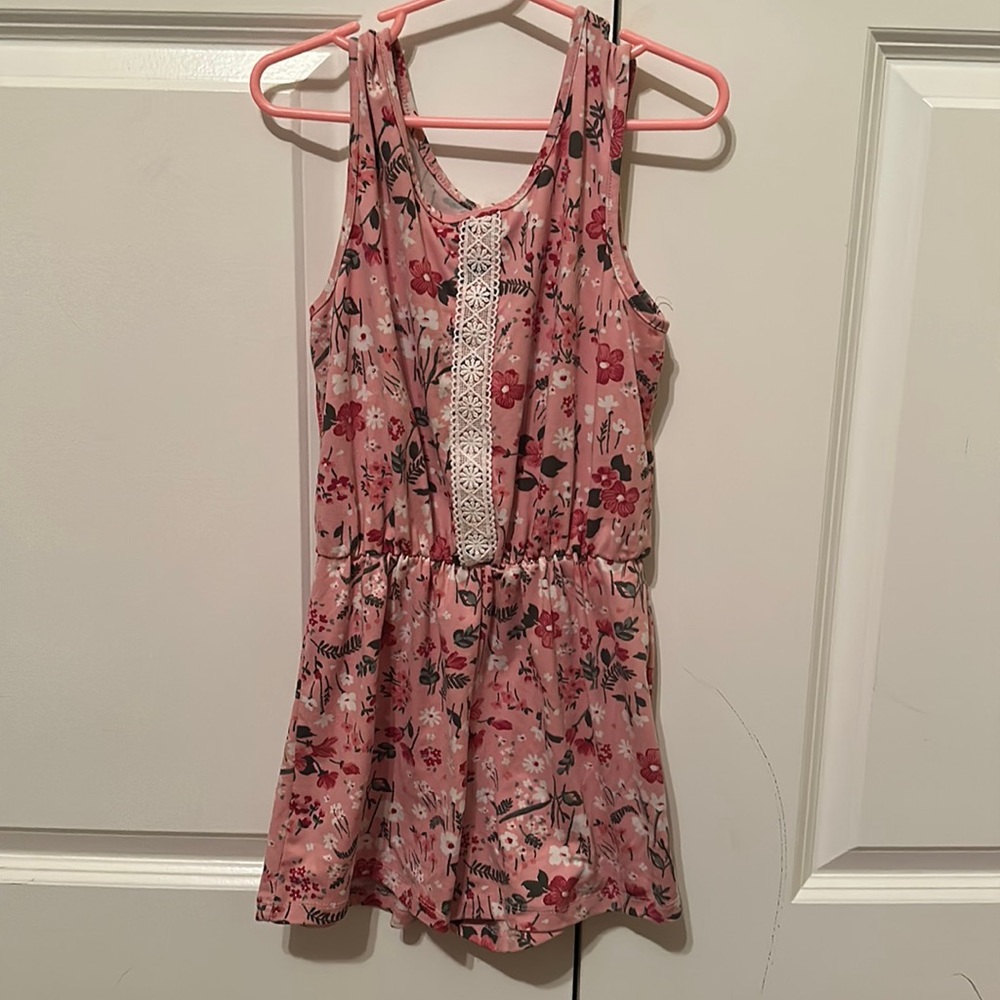 Pink floral romper. Lace front accent.